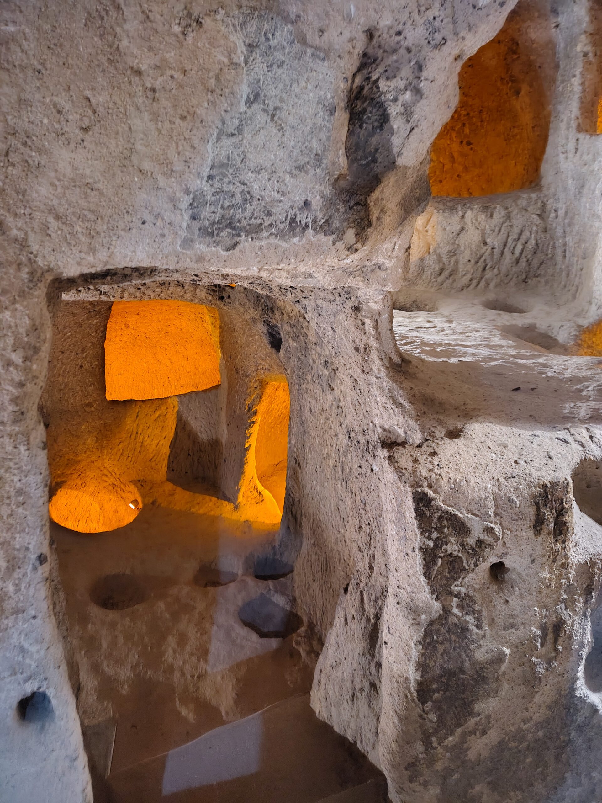 woman in black long sleeve shirt standing in front of mirror